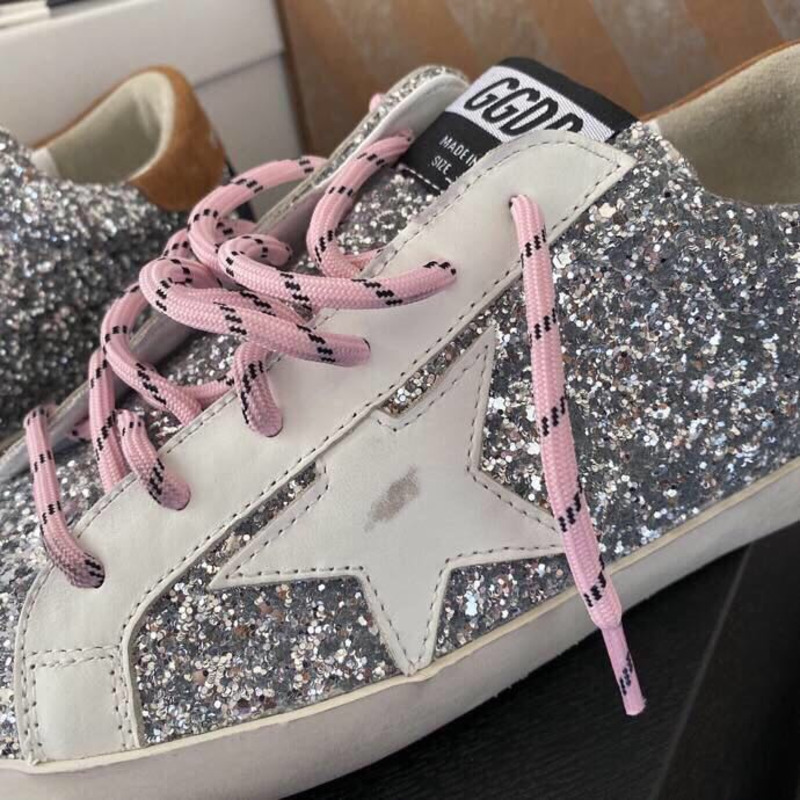 golden goose men’s S*per-star sneakers with sliver glitter and brown heel tab