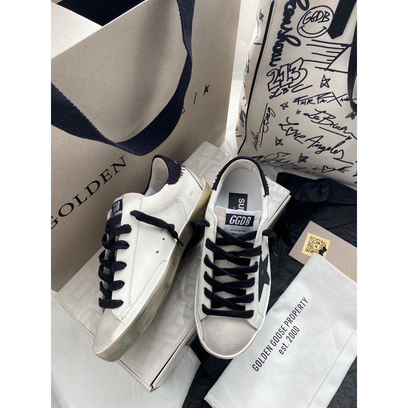 golden goose men’s S*per-star sneakers with black suede star and black heel tab