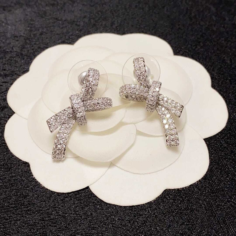 ch*el bow tie sparkling Di*m*nd earrings