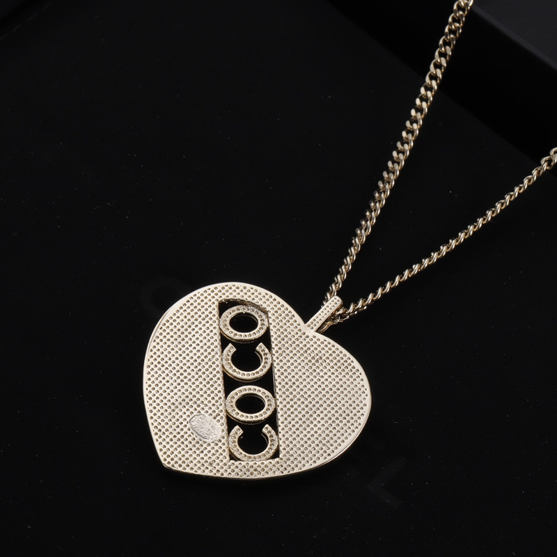 Ch*el pendant metal and crystal necklace